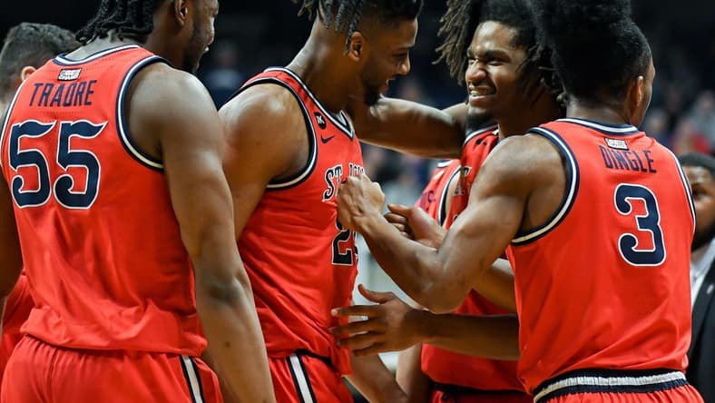 Feb 28, 2024; Indianapolis, Indiana, USA; St. John's Red Storm forward Zuby Ejiofor (24) and St. John's Red Storm forward Glenn Taylor Jr. (35) celebrate during a timeout against the Butler Bulldogs during the first half at Hinkle Fieldhouse. Mandatory Credit: Robert Goddin-USA TODAY Sports