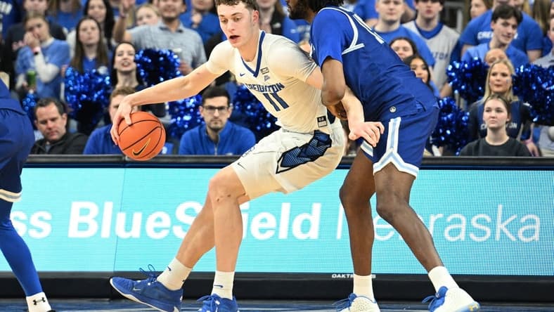 Feb 28, 2024; Omaha, Nebraska, USA; Creighton Bluejays center Ryan Kalkbrenner (11) drives against Seton Hall Pirates center Jaden Bediako (15) in the first half at CHI Health Center Omaha. Mandatory Credit: Steven Branscombe-USA TODAY Sports