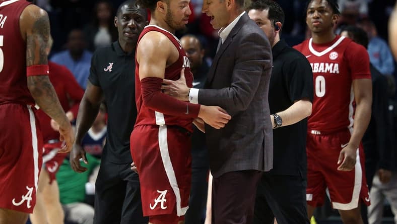 Feb 28, 2024; Oxford, Mississippi, USA; Alabama Crimson Tide head coach Nate Oats (right) embraces Alabama Crimson Tide guard Mark Sears (1) at the end of the first half against the Mississippi Rebels at The Sandy and John Black Pavilion at Ole Miss. Mandatory Credit: Petre Thomas-USA TODAY Sports
