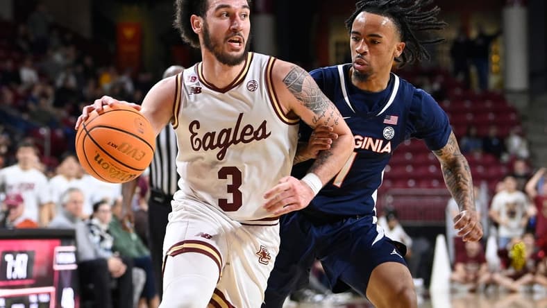 Feb 28, 2024; Chestnut Hill, Massachusetts, USA; Boston College Eagles guard Jaeden Zackery (3) drives the ball against Virginia Cavaliers guard Dante Harris (1) during the second half at Conte Forum. Mandatory Credit: Eric Canha-USA TODAY Sports