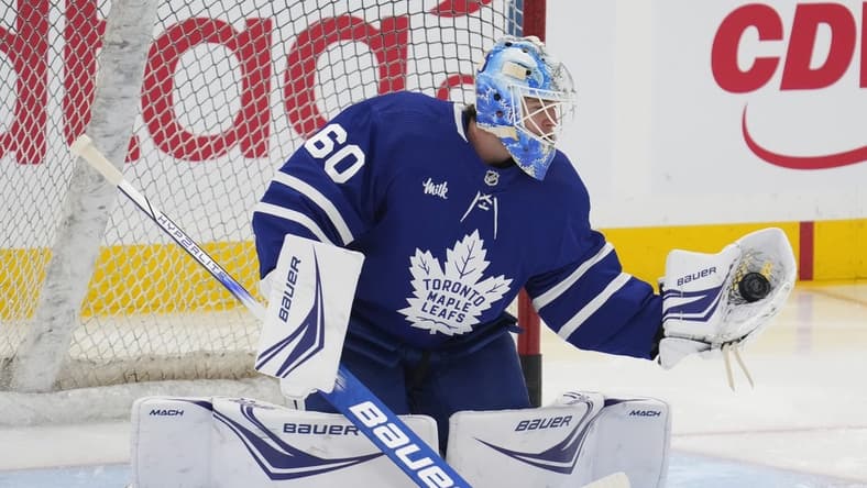 Feb 29, 2024; Toronto, Ontario, CAN; Toronto Maple Leafs goaltender Joseph Woll (60) makes a save during warm up before a game against the Arizona Coyotes at Scotiabank Arena. Mandatory Credit: John E. Sokolowski-USA TODAY Sports