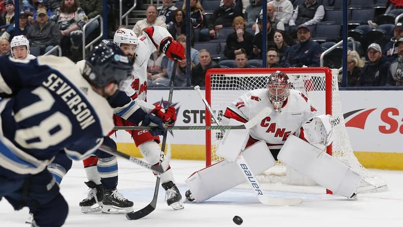 Feb 29, 2024; Columbus, Ohio, USA; Carolina Hurricanes goalie Spencer Martin (41) awaits the shot attempt from Columbus Blue Jackets defenseman Damon Severson (78) during the first period at Nationwide Arena. Mandatory Credit: Russell LaBounty-USA TODAY Sports