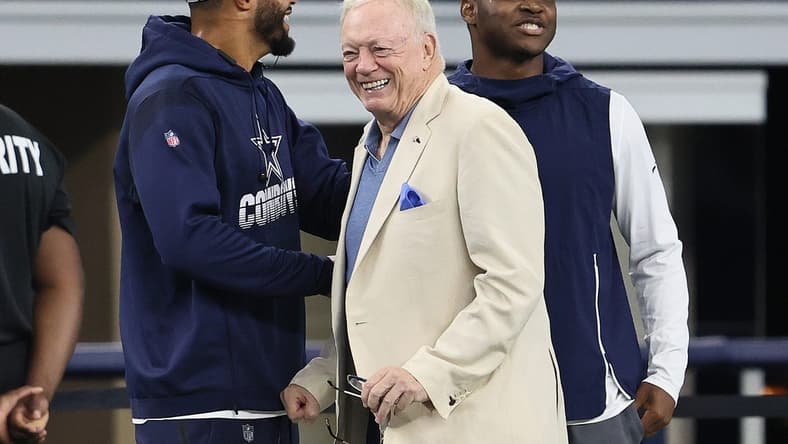 Aug 29, 2021; Arlington, Texas, USA; Dallas Cowboys quarterback Dak Prescott , owner Jerry Jones and receiver Amari Cooper talk prior to the game against the Jacksonville Jaguars at AT&T Stadium. Mandatory Credit: Matthew Emmons-USA TODAY Sports