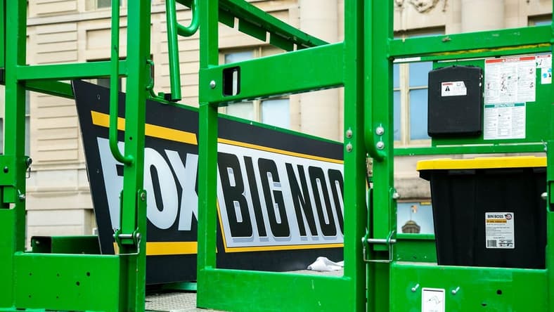 A Big Noon Kickoff logo is seen on a lift as setup continues for the Fox Sports NCAA football Big Noon Kickoff pregame show, Friday, Oct. 8, 2021, on the east side of the Pentacrest on the University of Iowa campus in Iowa City, Iowa.

211008 Big Noon Setup 007 Jpg