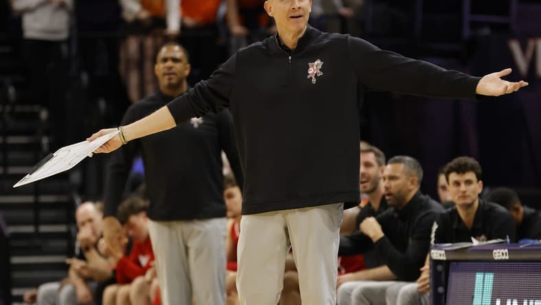 Jan 24, 2022; Charlottesville, Virginia, USA; Louisville Cardinals head coach Chris Mack gestures to a referee from the bench against the Virginia Cavaliers during the first half at John Paul Jones Arena. Mandatory Credit: Geoff Burke-USA TODAY Sports