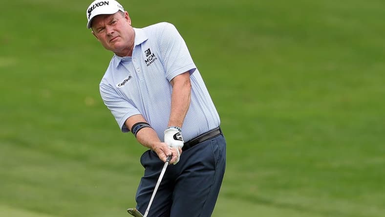 Joe Durant chips onto the green on the 4th hole during second round of the Bridgestone Senior Players Tournament at Firestone Country Club on Friday.

Bridgestonejl 10
