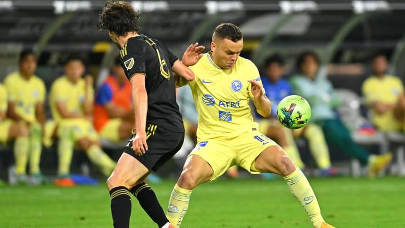 Aug 3, 2022; Los Angeles, California, US;   LAFC midfielder Ilie Sanchez (6) and Club America forward Jonathan Rodriguez (11) battle for the ball in the second half at SoFi Stadium. Mandatory Credit: Jayne Kamin-Oncea-USA TODAY Sports