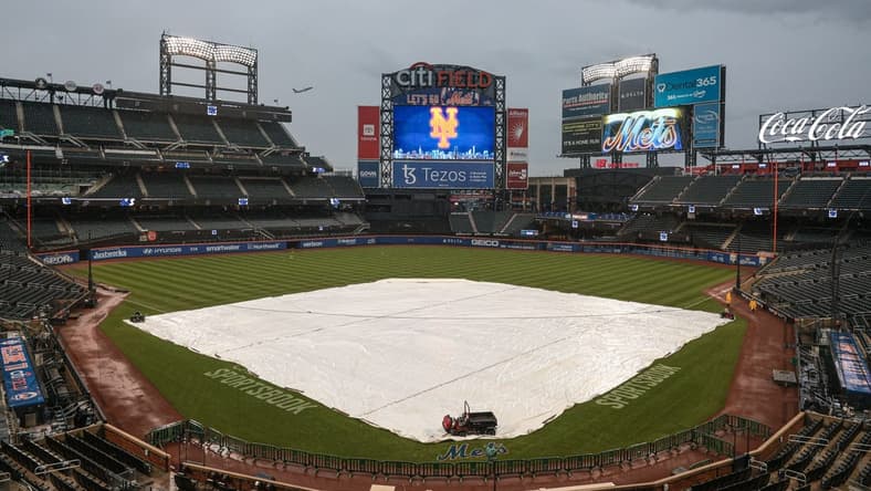 Oct 3, 2022; New York City, New York, USA; A general view of the tarp on the field before the game between the New York Mets and the Washington Nationals at Citi Field. Mandatory Credit: Vincent Carchietta-USA TODAY Sports