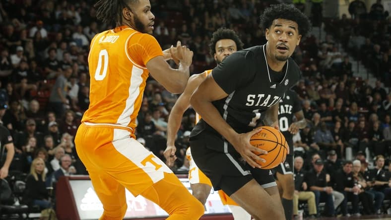 Jan 17, 2023; Starkville, Mississippi, USA; Mississippi State Bulldogs forward Tolu Smith (1) spins toward the basket as Tennessee Volunteers forward Jonas Aidoo (0) defends during the second half at Humphrey Coliseum. Mandatory Credit: Petre Thomas-USA TODAY Sports