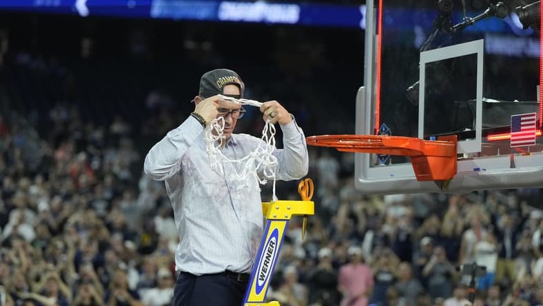 Apr 3, 2023; Houston, TX, USA; Connecticut Huskies head coach Dan Hurley celebrates after cutting down the net after defeating the San Diego State Aztecs in the national championship game of the 2023 NCAA Tournament at NRG Stadium. Mandatory Credit: Bob Donnan-USA TODAY Sports