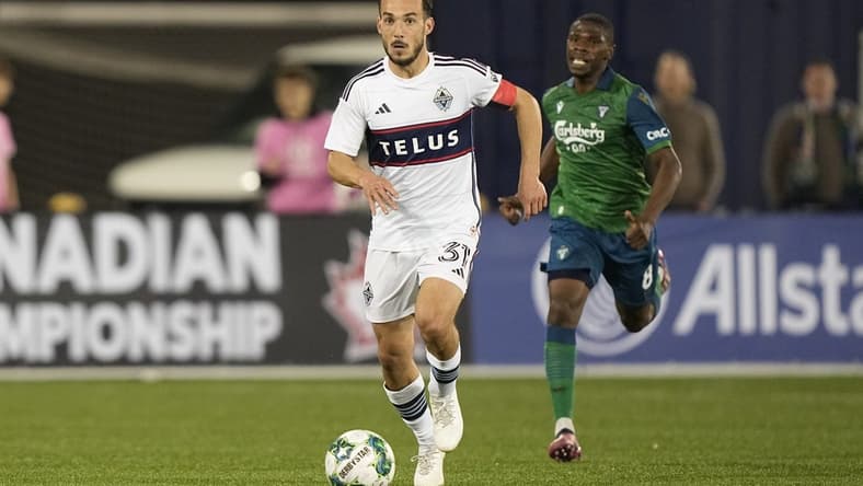 May 10, 2023; Toronto, Ontario, CAN; Vancouver Whitecaps midfielder Russell Teibert (31) dribbles the ball downfield against York United during the second half at York Lions Stadium. Mandatory Credit: John E. Sokolowski-USA TODAY Sports