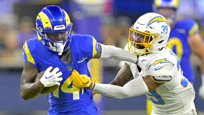 Aug 12, 2023; Inglewood, California, USA; Los Angeles Rams wide receiver Tyler Johnson (14) is stopped by Los Angeles Chargers cornerback Michael Jacquet (39) after a first down in the second half at SoFi Stadium. Mandatory Credit: Jayne Kamin-Oncea-USA TODAY Sports