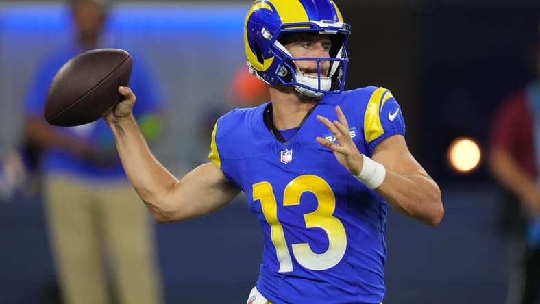 Aug 12, 2023; Inglewood, California, USA; Los Angeles Rams quarterback Stetson Bennett (13) throws the ball in the second half against the Los Angeles Chargers at SoFi Stadium. Mandatory Credit: Kirby Lee-USA TODAY Sports