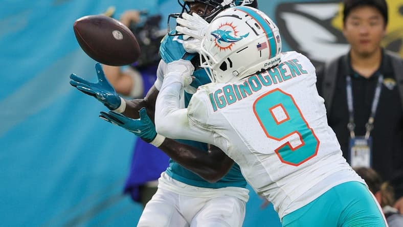 Aug 26, 2023; Jacksonville, Florida, USA; Jacksonville Jaguars wide receiver Calvin Ridley (0) makes a catch defended by Miami Dolphins cornerback Noah Igbinoghene (9) in the second quarter at EverBank Stadium. Mandatory Credit: Nathan Ray Seebeck-USA TODAY Sports