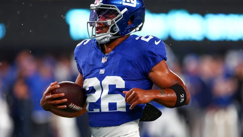 Sep 10, 2023; East Rutherford, New Jersey, USA; New York Giants running back Saquon Barkley (26) runs with the ball during warmups for their game against the Dallas Cowboys at MetLife Stadium. Mandatory Credit: Ed Mulholland-USA TODAY Sports