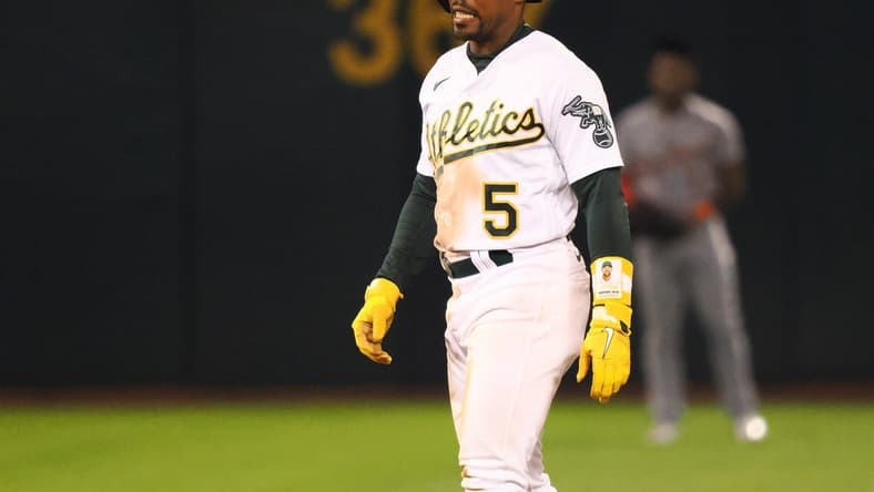 Sep 22, 2023; Oakland, California, USA; Oakland Athletics left fielder Tony Kemp (5) walks off an injury during the sixth inning against the Detroit Tigers at Oakland-Alameda County Coliseum. Mandatory Credit: Kelley L Cox-USA TODAY Sports