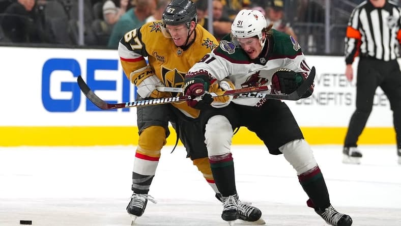 Sep 29, 2023; Las Vegas, Nevada, USA; Vegas Golden Knights left wing Tyler Benson (67) slows Arizona Coyotes right wing Josh Doan (91) during the first period at T-Mobile Arena. Mandatory Credit: Stephen R. Sylvanie-USA TODAY Sports