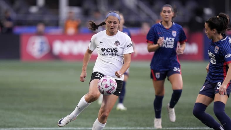 Oct 6, 2023; Seattle, Washington, USA; Washington Spirit forward Ashley Hatch (33) controls the ball as OL Reign defends during the first half at Lumen Field. Mandatory Credit: Stephen Brashear-USA TODAY Sports