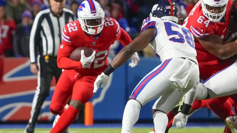 Oct 15, 2023; Orchard Park, New York, USA; New York Giants linebacker Bobby Okereke (58) tackles Buffalo Bills running back Damien Harris (22) during the first half at Highmark Stadium. Mandatory Credit: Gregory Fisher-USA TODAY Sports