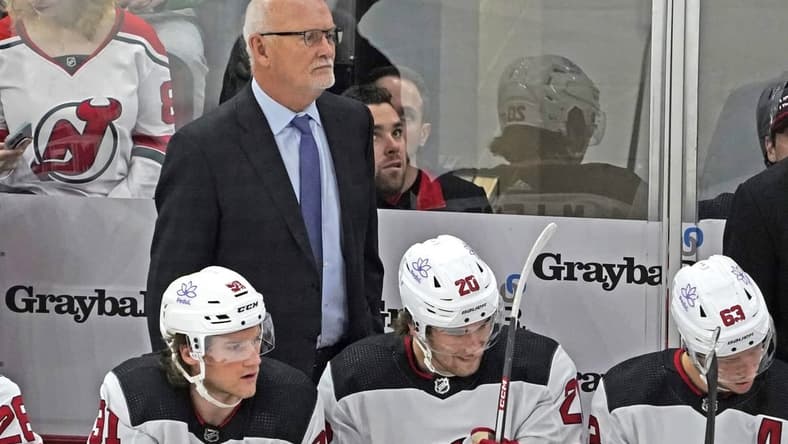 Nov 5, 2023; Chicago, Illinois, USA; New Jersey Devils head coach Lindy Ruff stands behind the bench during the first period at United Center. Mandatory Credit: David Banks-USA TODAY Sports