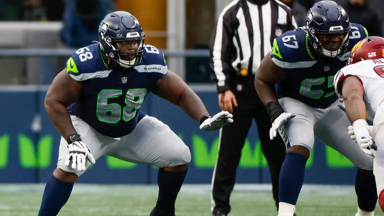 Nov 12, 2023; Seattle, Washington, USA; Seattle Seahawks guard Damien Lewis (68) reacts to a snap against the Washington Commanders during the second quarter at Lumen Field. Mandatory Credit: Joe Nicholson-USA TODAY Sports