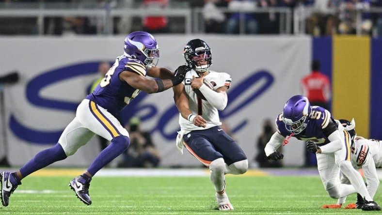 Nov 27, 2023; Minneapolis, Minnesota, USA; Chicago Bears quarterback Justin Fields (1) is tackled by Minnesota Vikings linebacker Danielle Hunter (99) and cornerback Mekhi Blackmon (5) as wide receiver Darnell Mooney (11) looks to block during the fourth quarter at U.S. Bank Stadium. Mandatory Credit: Jeffrey Becker-USA TODAY Sports