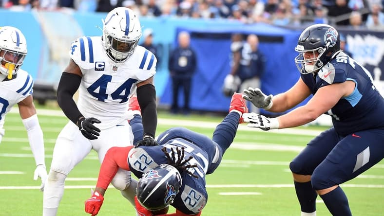 Tennessee Titans running back Derrick Henry (22) is tackled by Indianapolis Colts linebacker Zaire Franklin (44) during the second half at Nissan Stadium. Mandatory Credit: Christopher Hanewinckel-USA TODAY Sports