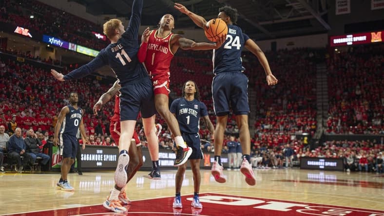 Dec 6, 2023; College Park, Maryland, USA;  Maryland Terrapins guard Jahmir Young (1) shoots around Penn State Nittany Lions forward Leo O'Boyle (11) during the second half at Xfinity Center. Mandatory Credit: Tommy Gilligan-USA TODAY Sports