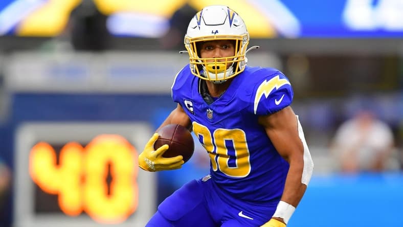Dec 10, 2023; Inglewood, California, USA; Los Angeles Chargers running back Austin Ekeler (30) runs the ball against the Denver Broncos during the first half at SoFi Stadium. Mandatory Credit: Gary A. Vasquez-USA TODAY Sports