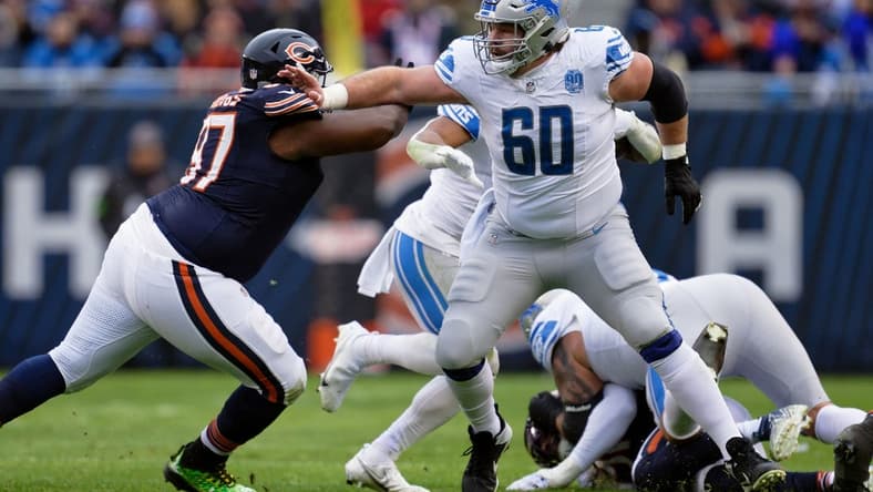 Dec 10, 2023; Chicago, Illinois, USA;  Detroit Lions offensive lineman Graham Glasgow (60) blocks against the Chicago Bears at Soldier Field. Mandatory Credit: Jamie Sabau-USA TODAY Sports