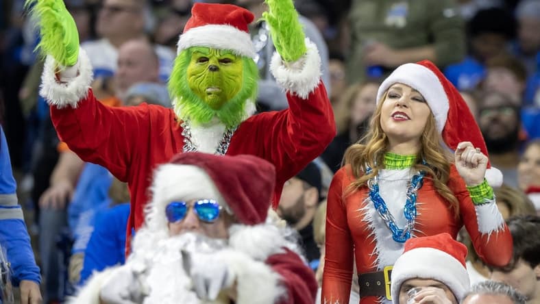 Dec 16, 2023; Detroit, Michigan, USA; Detroit Lions fans dressed in Christmas attire react in the first half against the Denver Broncos at Ford Field. Mandatory Credit: David Reginek-USA TODAY Sports