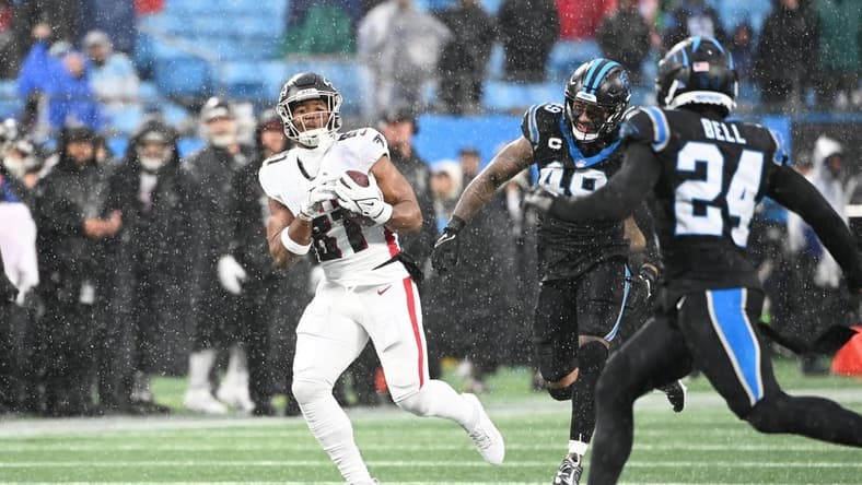 Dec 17, 2023; Charlotte, North Carolina, USA; Atlanta Falcons tight end Jonnu Smith (81) catches the ball as Carolina Panthers linebacker Frankie Luvu (49) and safety Vonn Bell (24) defend in the second quarter at Bank of America Stadium. Mandatory Credit: Bob Donnan-USA TODAY Sports