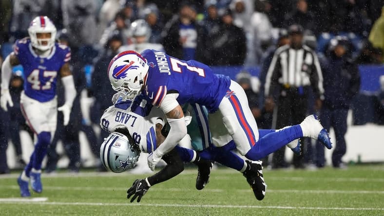 Buffalo Bills cornerback Taron Johnson (7) makes the tackle on Dallas Cowboys wide receiver CeeDee Lamb (88).