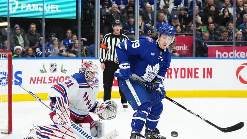 Dec 19, 2023; Toronto, Ontario, CAN; Toronto Maple Leafs left wing Tyler Bertuzzi (59) battles for the puck in front of New York Rangers goaltender Igor Shesterkin (31) during the third period at Scotiabank Arena. Mandatory Credit: Nick Turchiaro-USA TODAY Sports