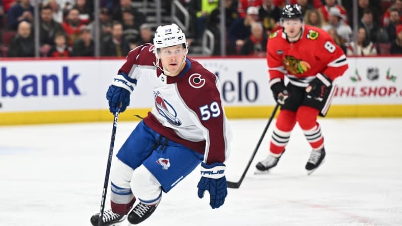 Dec 19, 2023; Chicago, Illinois, USA; Colorado Avalanche forward Ben Meyers (59) controls the puck in the first period against the Chicago Blackhawks at United Center. Mandatory Credit: Jamie Sabau-USA TODAY Sports