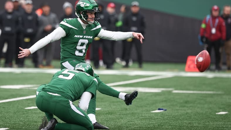 Dec 24, 2023; East Rutherford, New Jersey, USA; New York Jets place kicker Greg Zuerlein (9) kicks a field goal as punter Thomas Morstead (5) holds during the first half against the Washington Commanders at MetLife Stadium. Mandatory Credit: Vincent Carchietta-USA TODAY Sports
