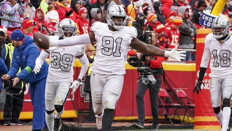 Dec 25, 2023; Kansas City, Missouri, USA; Las Vegas Raiders defensive tackle Bilal Nichols (91) celebrates after recovering a fumble to score against the Kansas City Chiefs during the game at GEHA Field at Arrowhead Stadium. Mandatory Credit: Denny Medley-USA TODAY Sports