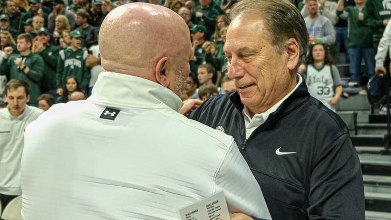 Michigan State coach Tom Izzo pictured greeting Indiana State coach Josh Schertz before the start of the game at the Breslin Center Saturday, Dec. 30, 2023.