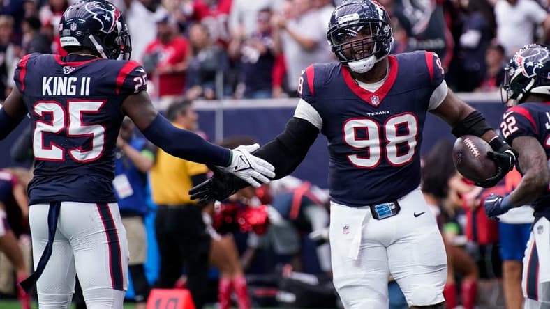 Houston Texans defensive tackle Sheldon Rankins (98) celebrates his touchdown off a ball fumbled by Tennessee Titans quarterback Will Levis during the second quarter at NRG Stadium in Houston, Texas., Sunday, Dec. 31, 2023.