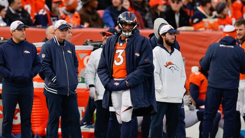 Dec 31, 2023; Denver, Colorado, USA; Denver Broncos quarterback Russell Wilson (3) looks on from the sideline in the first quarter against the Los Angeles Chargers at Empower Field at Mile High. Mandatory Credit: Isaiah J. Downing-USA TODAY Sports