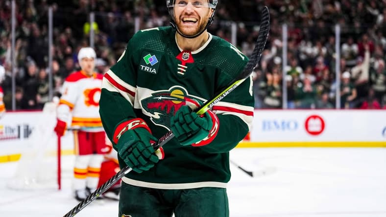 Jan 2, 2024; Saint Paul, Minnesota, USA; Minnesota Wild defenseman Dakota Mermis (6) celebrates a goal scored by left wing Pat Maroon (not pictured) during the second period against the Calgary Flames at Xcel Energy Center. Mandatory Credit: Brace Hemmelgarn-USA TODAY Sports
