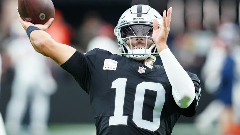 Jan 7, 2024; Paradise, Nevada, USA; Las Vegas Raiders quarterback Jimmy Garoppolo (10) warms up before a game against the Denver Broncos at Allegiant Stadium. Mandatory Credit: Stephen R. Sylvanie-USA TODAY Sports