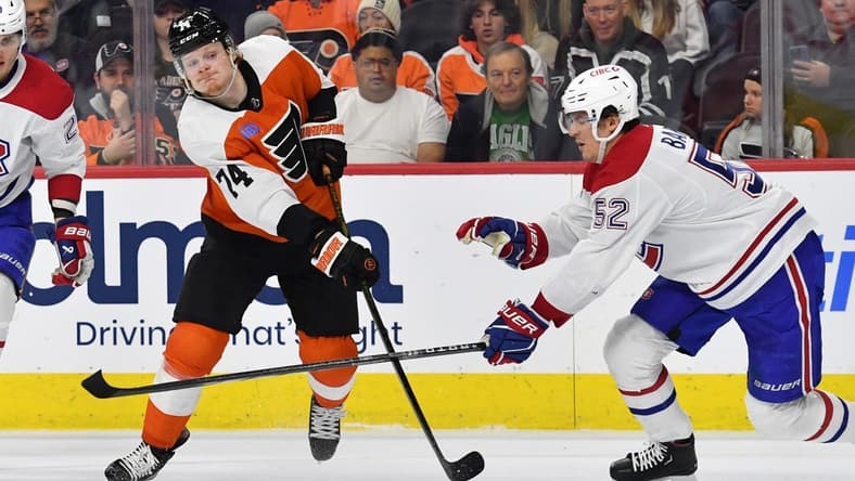 Jan 10, 2024; Philadelphia, Pennsylvania, USA; Philadelphia Flyers right wing Owen Tippett (74) takes a shot on goal against Montreal Canadiens defenseman Justin Barron (52) during third period at Wells Fargo Center. Mandatory Credit: Eric Hartline-USA TODAY Sports