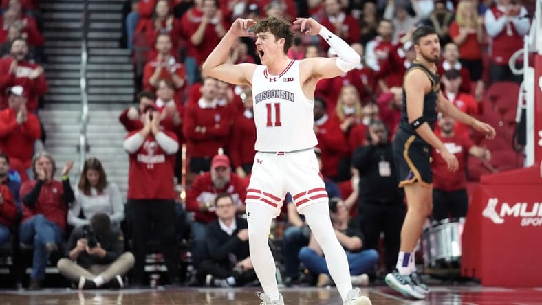 Jan 13, 2024; Madison, Wisconsin, USA; Wisconsin Badgers guard Max Klesmit (11) gestures making a three point basket during the second half at the Kohl Center. Mandatory Credit: Kayla Wolf-USA TODAY Sports