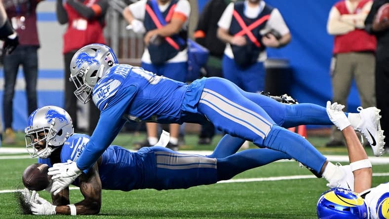 Jan 14, 2024; Detroit, Michigan, USA; Detroit Lions cornerback Cameron Sutton (1) and linebacker Jalen Reeves-Maybin (42) break up a pass during the first half of a 2024 NFC wild card game against the Los Angeles Rams at Ford Field. Mandatory Credit: Lon Horwedel-USA TODAY Sports