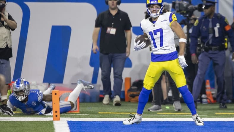 Jan 14, 2024; Detroit, Michigan, USA; Los Angeles Rams wide receiver Puka Nacua (17) scores a touchdown against Detroit Lions safety C.J. Gardner-Johnson (2) during the first half of a 2024 NFC wild card game at Ford Field. Mandatory Credit: David Reginek-USA TODAY Sports