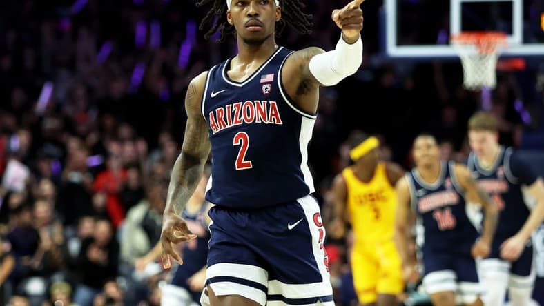 Arizona Wildcats guard Caleb Love (2) celebrates a 3-point basket against the USC Trojans at McKale Center. Mandatory Credit: Zachary BonDurant-USA TODAY Sports