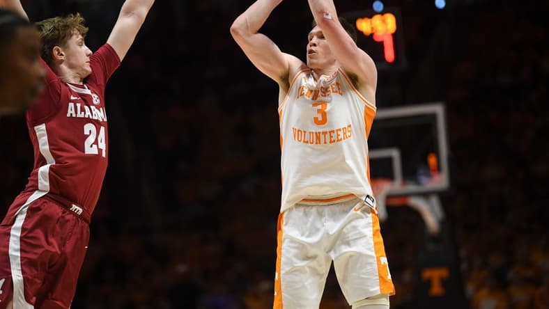 Tennessee guard Dalton Knecht (3) shoots the ball as Alabama forward Sam Walters (24) blocks during the NCAA game at Thompson-Boling Arena at Food City Center, Saturday, Jan. 20, 2024.