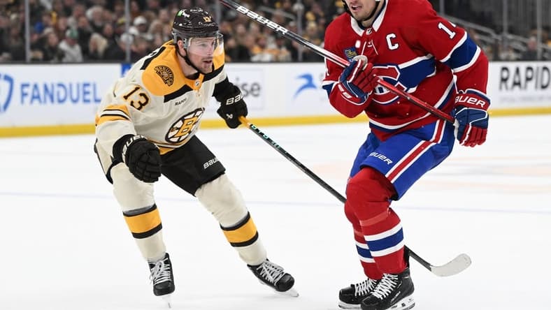 Jan 20, 2024; Boston, Massachusetts, USA; Montreal Canadiens center Nick Suzuki (14) skates against Boston Bruins center Charlie Coyle (13) during the second period at the TD Garden. Mandatory Credit: Brian Fluharty-USA TODAY Sports