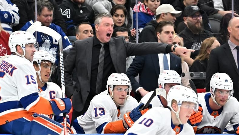 Feb 5, 2024; Toronto, Ontario, CAN;   New York Islanders head coach Patrick Roy gestures as he speaks to his players in the second period against the Toronto Maple Leafs at Scotiabank Arena. Mandatory Credit: Dan Hamilton-USA TODAY Sports